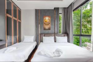 Postel nebo postele na pokoji v ubytování Aqua Pool Villa By Drh + 36 fotografií