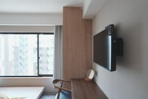 TV a/nebo společenská místnost v ubytování ICHIYU HOTEL ASAKUSA