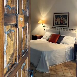 Postel nebo postele na pokoji v ubytování Agriturismo Tenuta Lagala