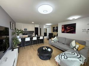 a living room with a couch and a table at Abades confort & luxury in Abades