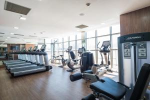 a gym with several treadmills and cardio machines at Windsor Marapendi Hotel in Rio de Janeiro
