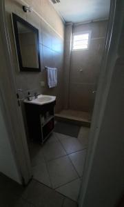 a bathroom with a sink and a shower at Faluma Quilmes in Quilmes +6 photos