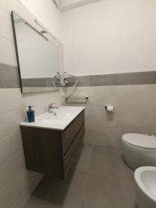 Koupelna v ubytování Sul Corso - Taormina Apartmets + 2 fotografie
