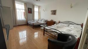 a room with two beds and a chair in it at Inter20 in Vienna