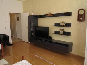 a living room with a flat screen tv on a wall at Inter20 in Vienna