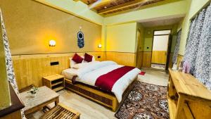 a bedroom with a large bed in a room at Hotel Spiti House in Kaza