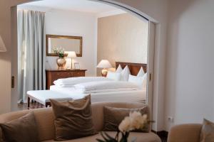 Postel nebo postele na pokoji v ubytování Hotel Hanswirt