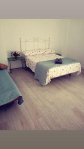 Katil atau katil-katil dalam bilik di Alona Home