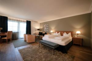 Postel nebo postele na pokoji v ubytování Hotel Hanswirt