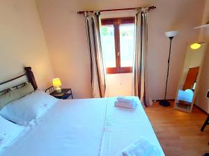 Postel nebo postele na pokoji v ubytování Elia House