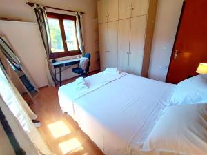 Postel nebo postele na pokoji v ubytování Elia House