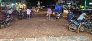 a group of people on motorcycles on a city street at R K Lodge & Mini Function Hall in Singarāyakonda +5 photos