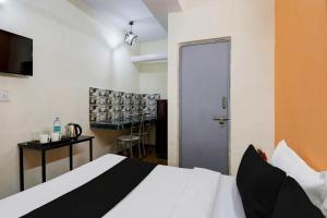 Postel nebo postele na pokoji v ubytování Super Hotel O Malviya Nagar Inn