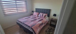 Postel nebo postele na pokoji v ubytování Departamento Villarrica Vista al Lago y Volcanes + 44 fotografií