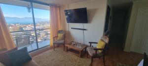 TV a/nebo společenská místnost v ubytování Departamento Villarrica Vista al Lago y Volcanes