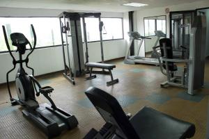a gym with several exercise bikes and tread machines at Hotel Emperador VENEZUELA in Valencia