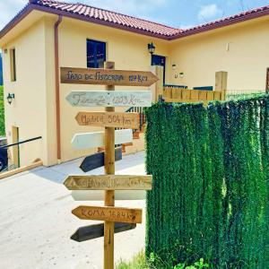 a group of signs in front of a house at A casa do Porto cerca de Cedeira y de la playa de Pantín in Valdoviño
