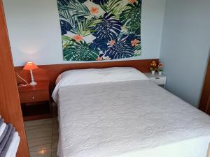 Ein Bett oder Betten in einem Zimmer der Unterkunft Ada Neptuno Apartamento, Aire acondicionado, WiFi, Piscinas, Parking