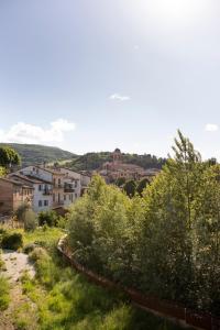 a view of a town with trees and buildings at Fritto Misto Comune Stays in Fabriano