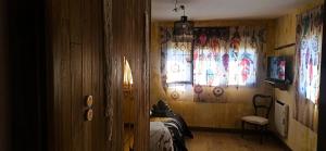 a bedroom with a bed and a window with curtains at El Guardaviñas, entre Montes y Viñedos in Ábalos +262 photos