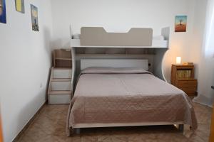 Ένα ή περισσότερα κρεβάτια σε δωμάτιο στο Casa vacanze Sonia