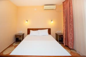 Cama ou camas em um quarto em Apartmani Becici