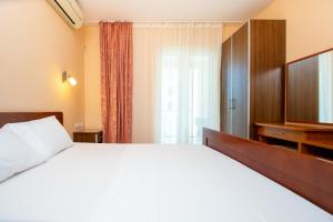 Cama ou camas em um quarto em Apartmani Becici