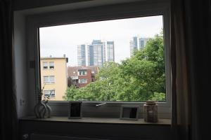 a window with a view of a city at Apartment Deich 21 in Bremerhaven
