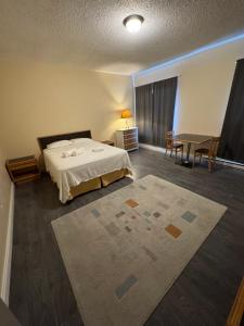 Ένα ή περισσότερα κρεβάτια σε δωμάτιο στο Kenricia Hotel