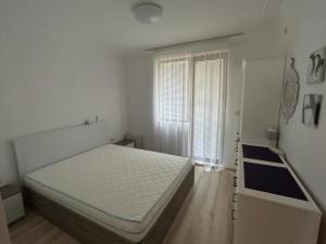 Postel nebo postele na pokoji v ubytování Ravda Apolon 9 Apartment