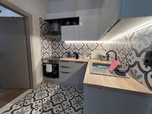 a kitchen with a sink and a counter top at Magda’s little house in Petra