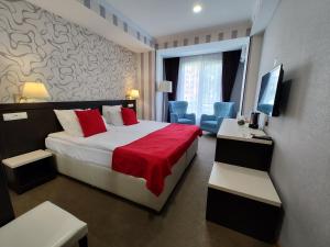 Postel nebo postele na pokoji v ubytování East Gate Boutique Hotel