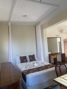 Postel nebo postele na pokoji v ubytování Breezebay Pool hotel