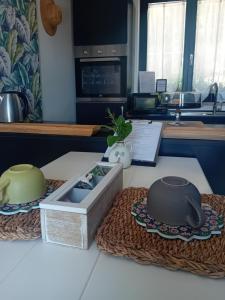 a kitchen counter with a box on a table at Ama(A’ in Fano