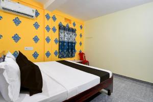 Ένα ή περισσότερα κρεβάτια σε δωμάτιο στο Hotel O SHANTI GUEST HOUSE