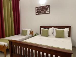 Postel nebo postele na pokoji v ubytování BlissFam Villa & Hostel