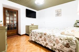 Postel nebo postele na pokoji v ubytování La Joannassiène, maison Ardéchoise de caractère