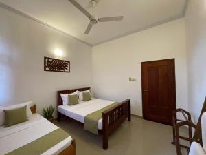 Postel nebo postele na pokoji v ubytování BlissFam Villa & Hostel