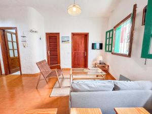 a living room with a couch and a table at Fee4Me 5 Min from Sardina Beach in Gáldar