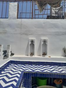 a swimming pool with a blue and white tile floor at Sky Blue in Tangier +115 photos