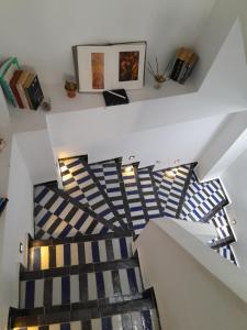 a staircase in a house with blue and white at Sky Blue in Tangier