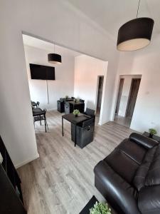 a living room with a couch and a table at Hostel Pearl in Portimão