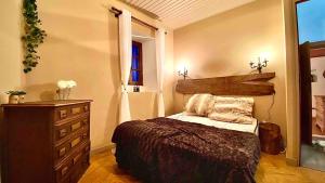 Postel nebo postele na pokoji v ubytování La Joannassiène, maison Ardéchoise de caractère