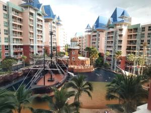 a view of a resort with a pirate ship in the water at Caribbean Water Park Hotel in Pattaya South +11 photos