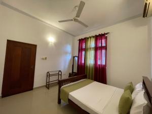 Postel nebo postele na pokoji v ubytování BlissFam Villa & Hostel
