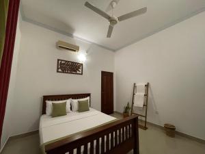 Postel nebo postele na pokoji v ubytování BlissFam Villa & Hostel