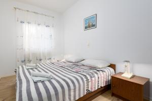 Postel nebo postele na pokoji v ubytování Apartments Snjezana by El-Pi Tours