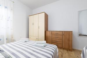 Postel nebo postele na pokoji v ubytování Apartments Snjezana by El-Pi Tours