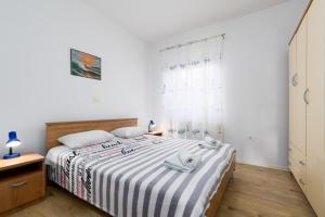 Postel nebo postele na pokoji v ubytování Apartments Snjezana by El-Pi Tours