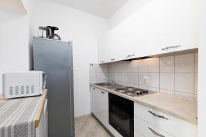 Kuchyň nebo kuchyňský kout v ubytování Apartments Snjezana by El-Pi Tours